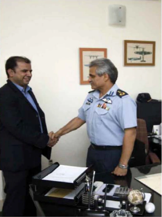 ECOMS representative with a Pakistan Air Force officer in an inauguration photograph from the company profile